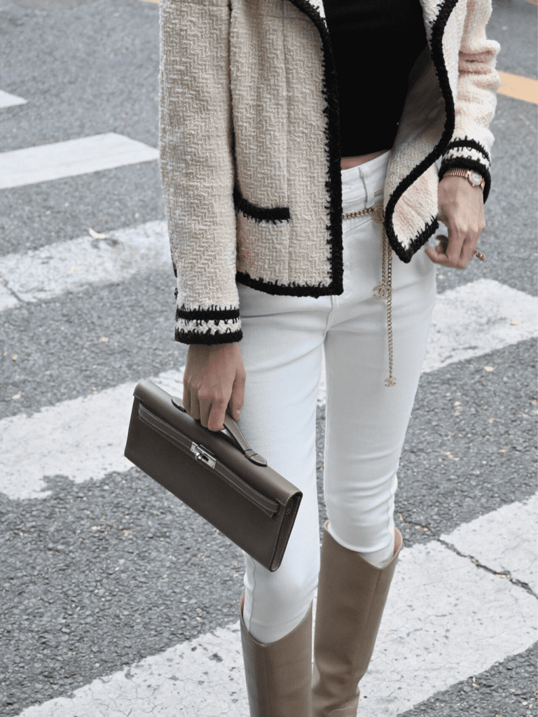Hermès Kelly Cut clutch bag styled with chic outfit on the street.