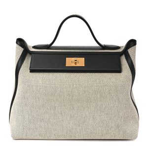Hermes 24 24 bag in size 35, crafted from black Viking canvas and Swift leather.