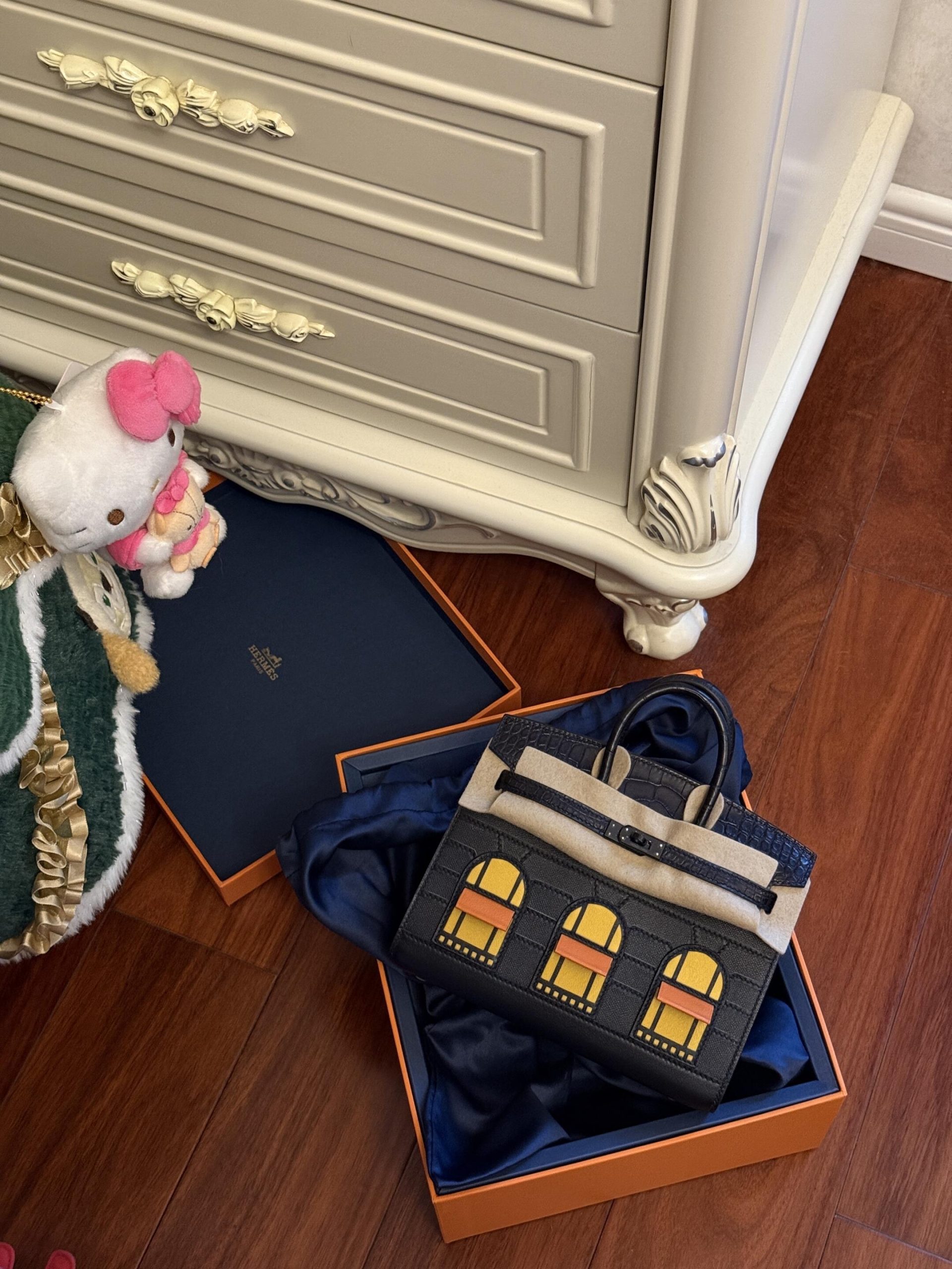 Hermes Birkin Faubourg So Black house bag placed in a luxury home setting