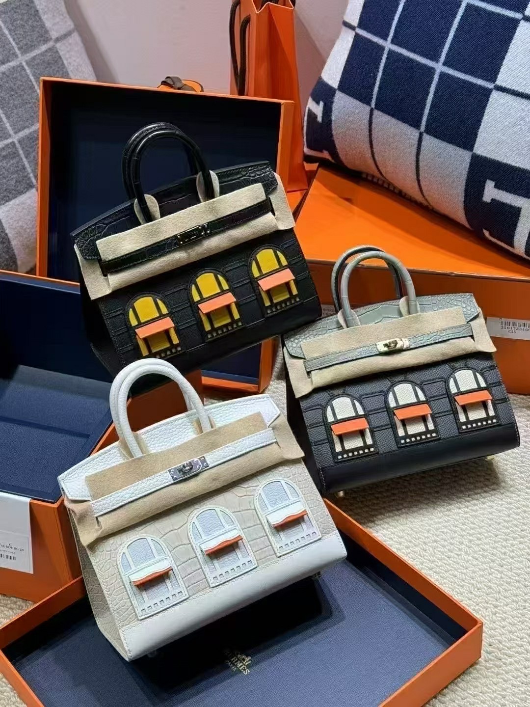 A collection of three Hermès Birkin Faubourg bags in different editions