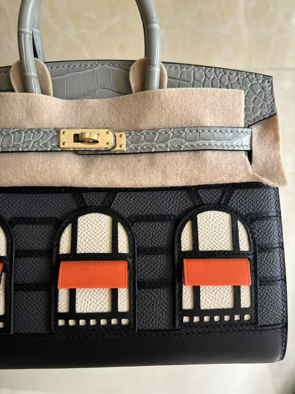 A micro close-up of the right side of the Faubourg Birkin facade