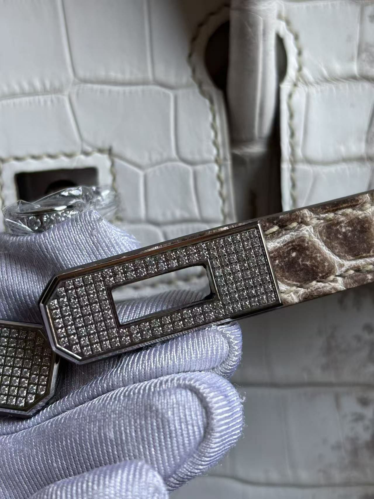 Close-up of Moissanite micro-pavé diamond settings on a Himalayan Birkin 25 plaque