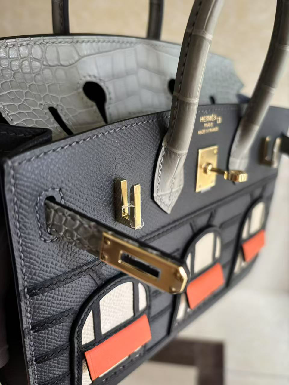 Micro detail of the Faubourg Birkin hardware plaque