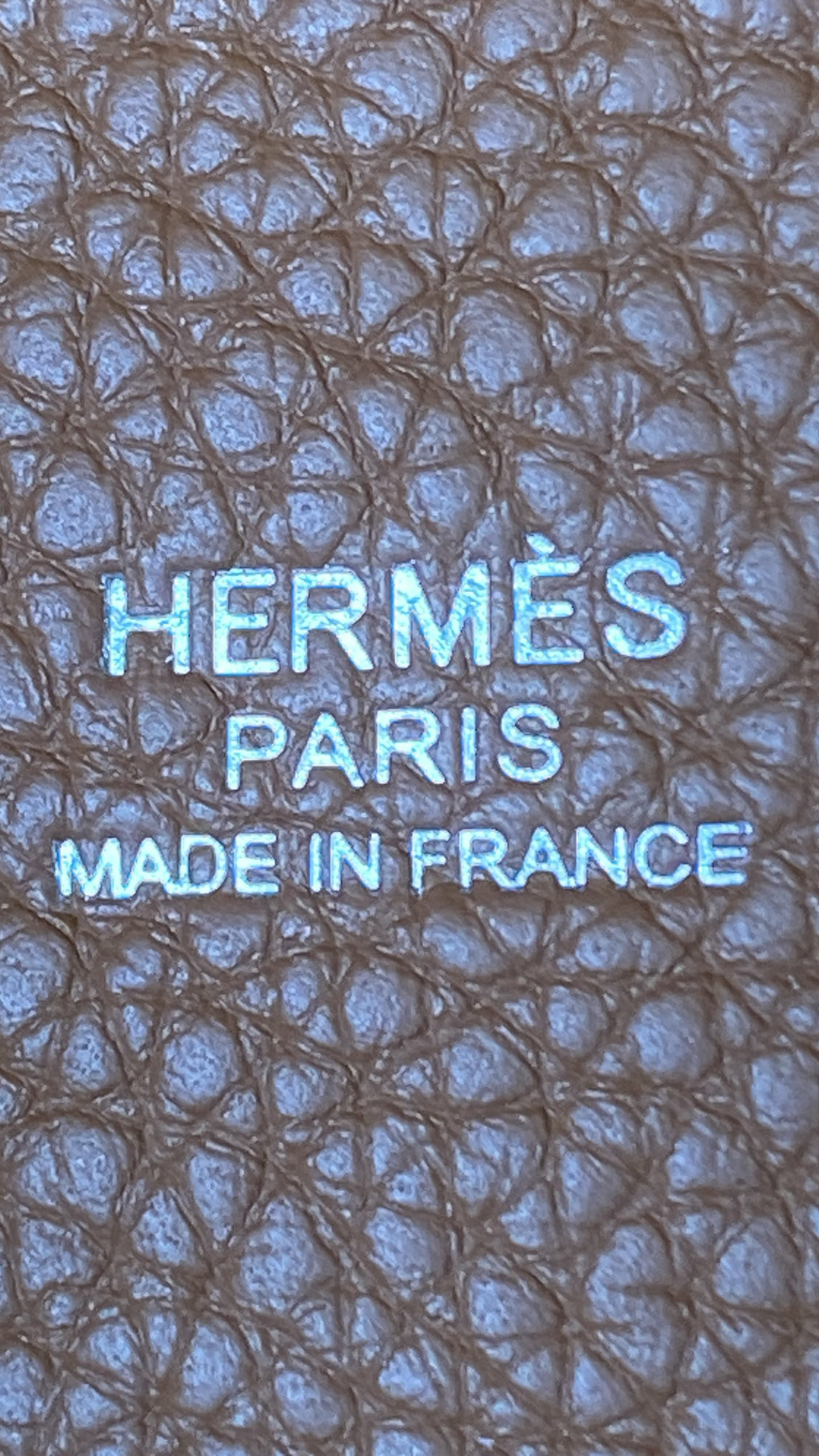 Heat stamp logo on Gold leather Hermes Picotin, reading "HERMÈS PARIS MADE IN FRANCE" with sharp, crisp edges.