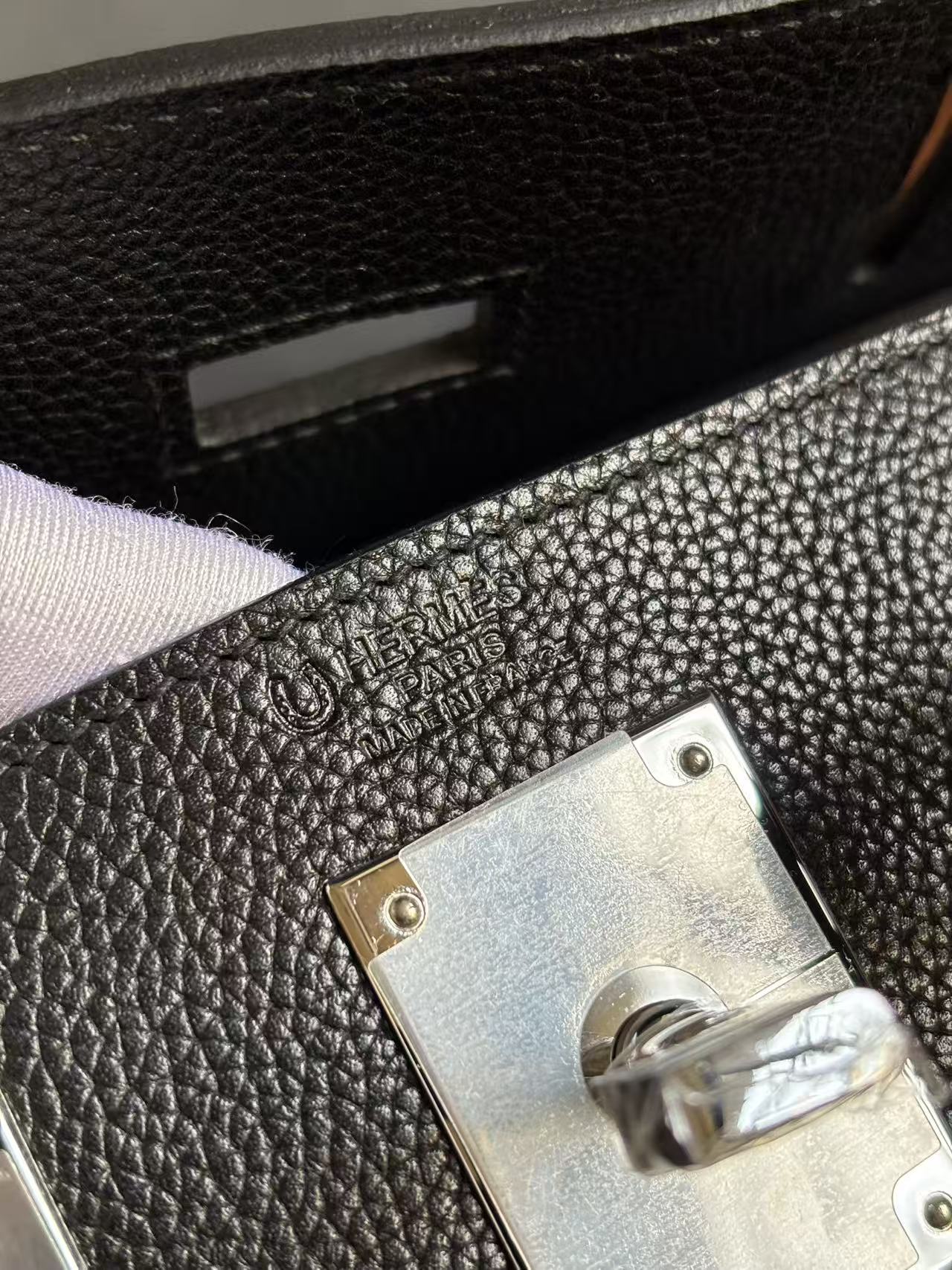 Close-up of the crisp "HERMÈS PARIS MADE IN FRANCE" heat stamp on the Barenia Faubourg HAC a Dos PM