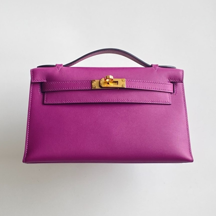 Elegant purple Epsom hermes kelly pochette clutch captured from a front perspective