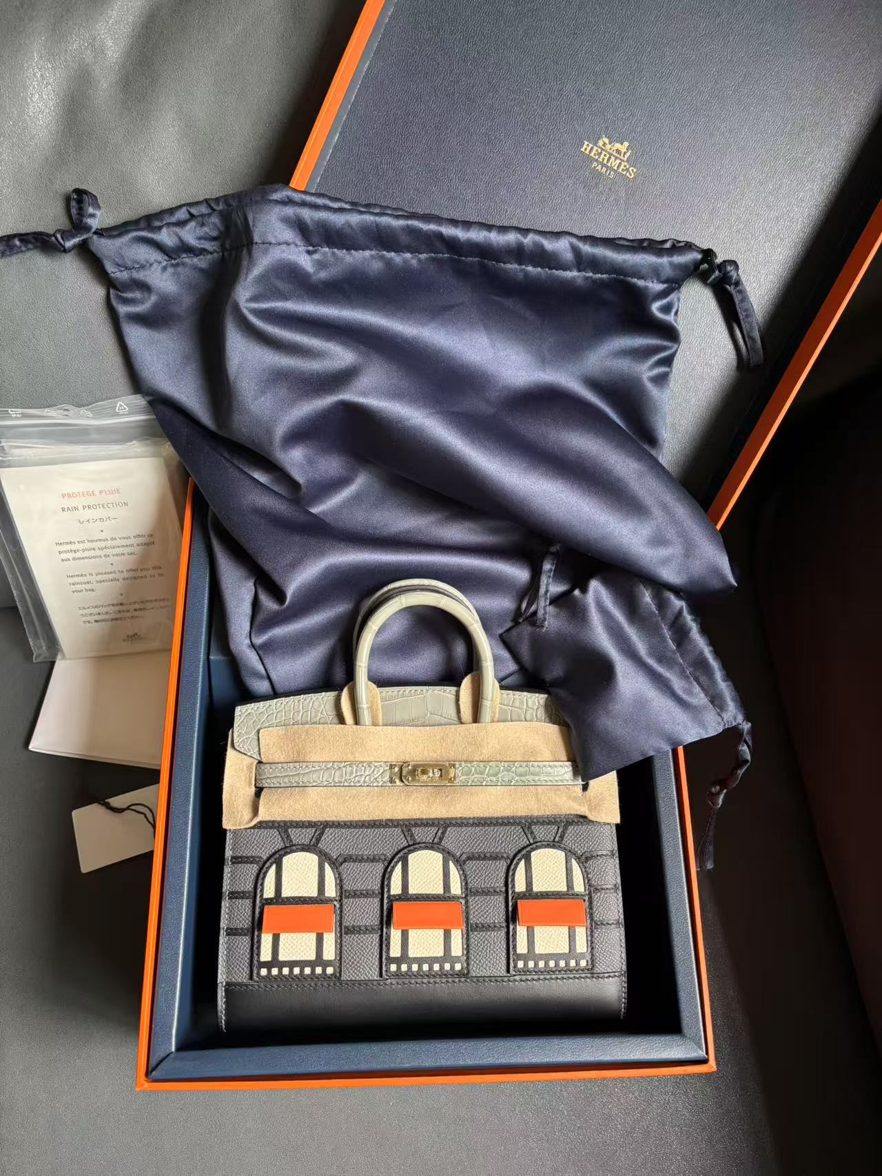 An unboxing view of the Hermes Faubourg Birkin 20 Rainy Day edition